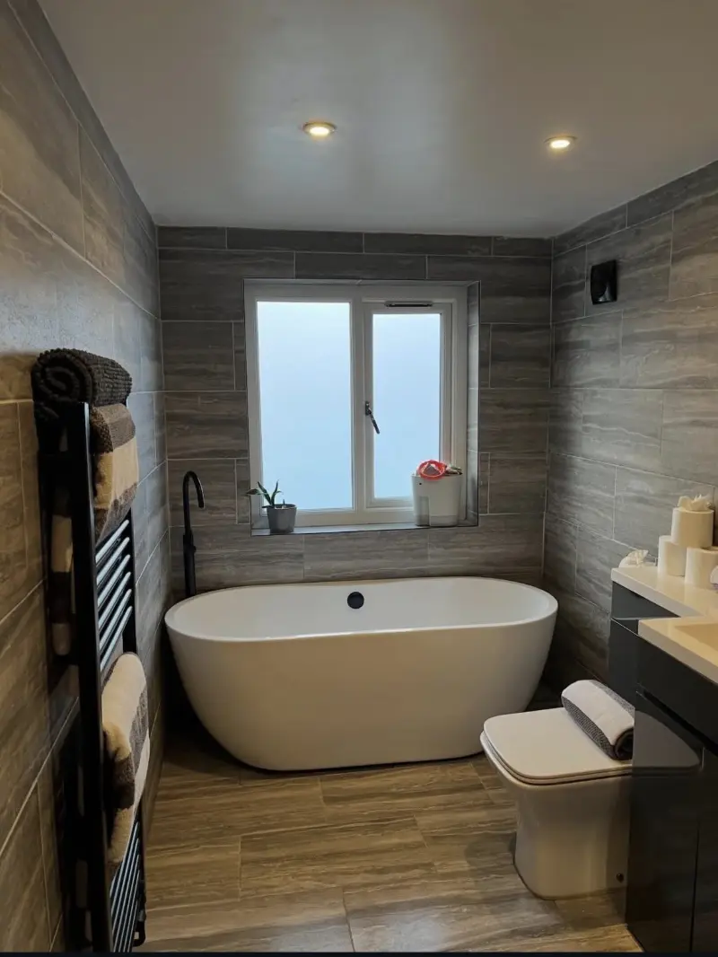A spotless bathroom with a freestanding bath