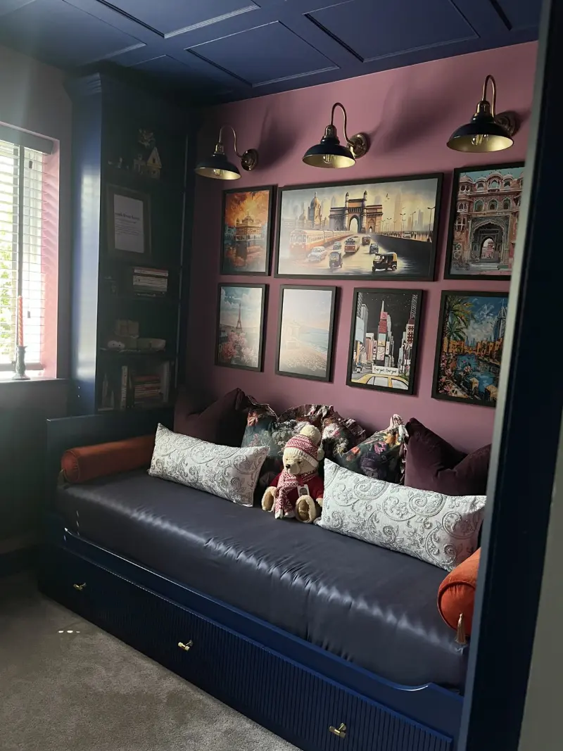 Reading nook with navy daybed and gallery wall