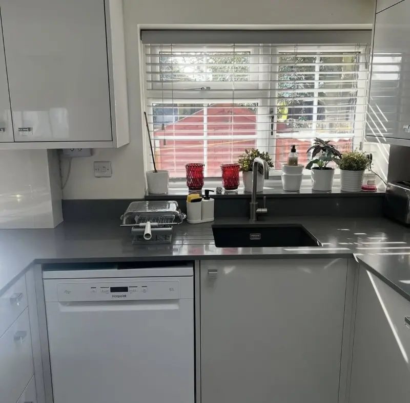 A gleaming grey gloss kitchen after a deep clean