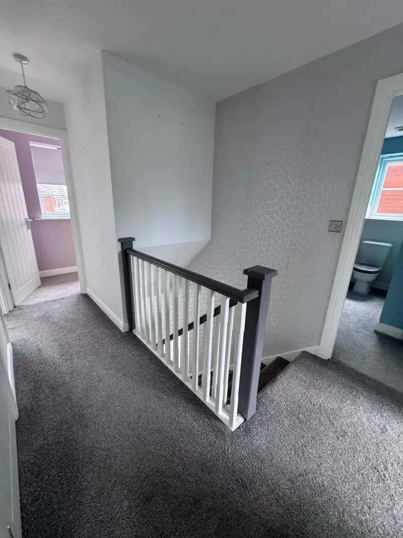 Bright landing with freshly vacuumed carpet