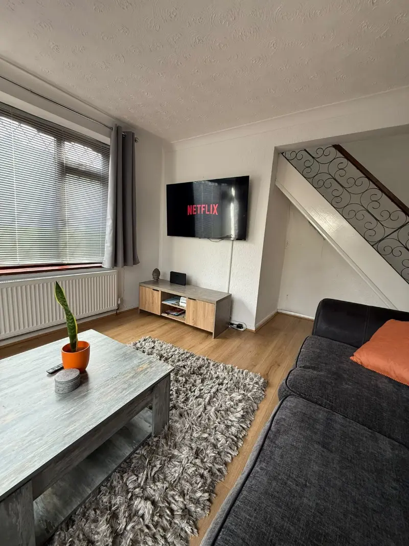Tidy lounge with grey sofa and coffee table
